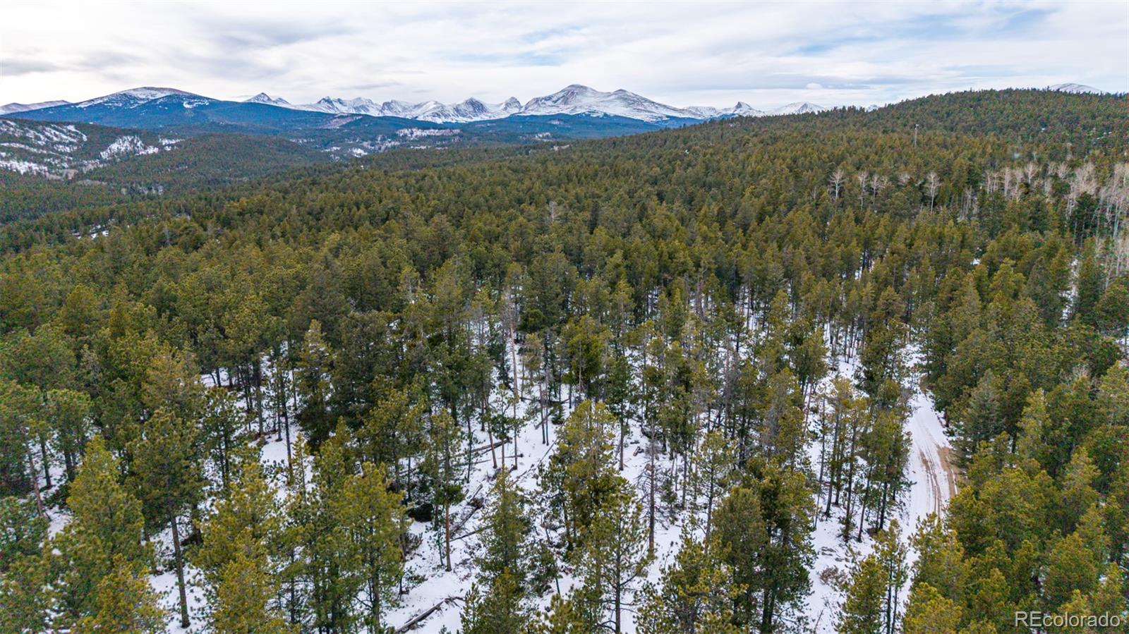 190 Hard Way Road Ward, CO 80481 - Photo 17 of 29 a view of a town with mountains in the background