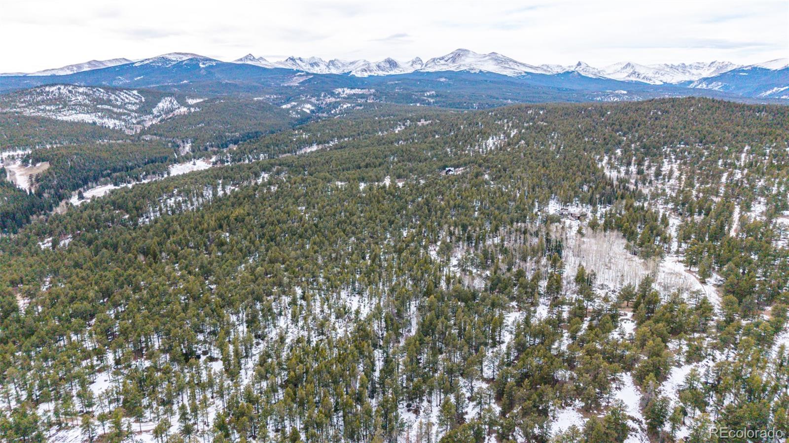 190 Hard Way Road Ward, CO 80481 - Photo 8 of 29 a view of a mountain range with lush green hillside