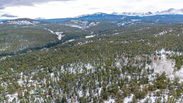 a view of a town with mountains in the background