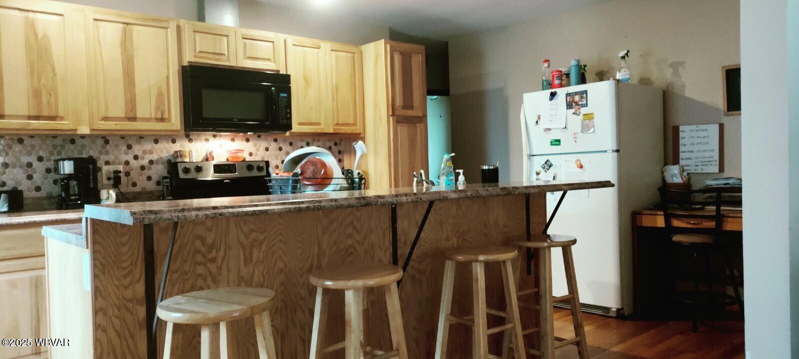 5477 Bloomingrove Road Cogan Station, PA 17728 - Photo 7 of 12 Kitchen Breakfast Bar