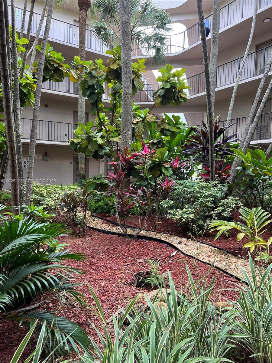 8400 Southwest 133rd Avenue Road, Unit 121 Miami, FL 33183 - Photo 22 of 43 a view of a garden with flowers