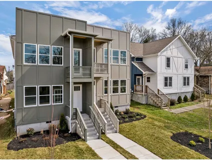 a living room with furniture or couch and a potted plant