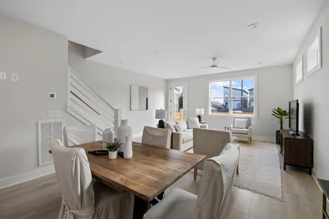a kitchen with a sink cabinets and wooden floor
