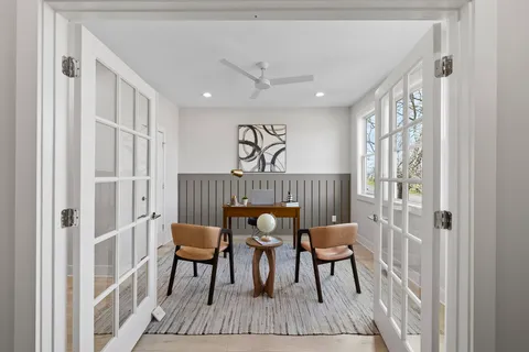 a bedroom with a bed and cabinets