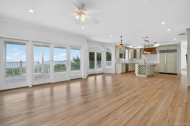 a view of kitchen with furniture and wooden floor