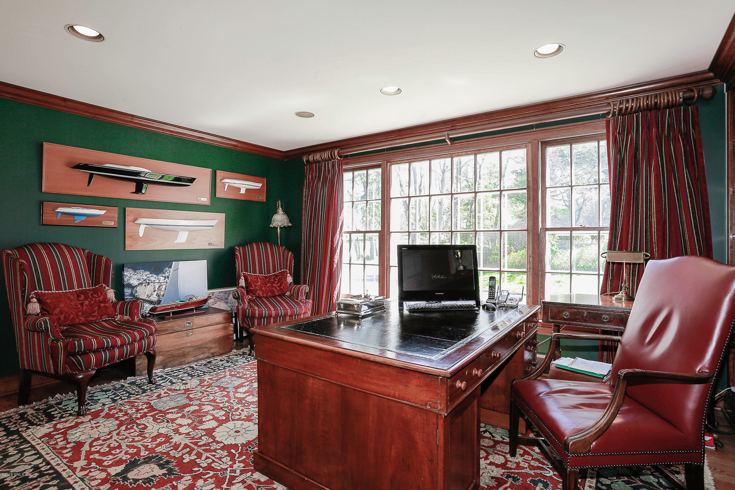 33 Doubling Road Greenwich, CT 06830 - Photo 12 of 45 a living room with furniture a flat screen tv and a floor to ceiling window