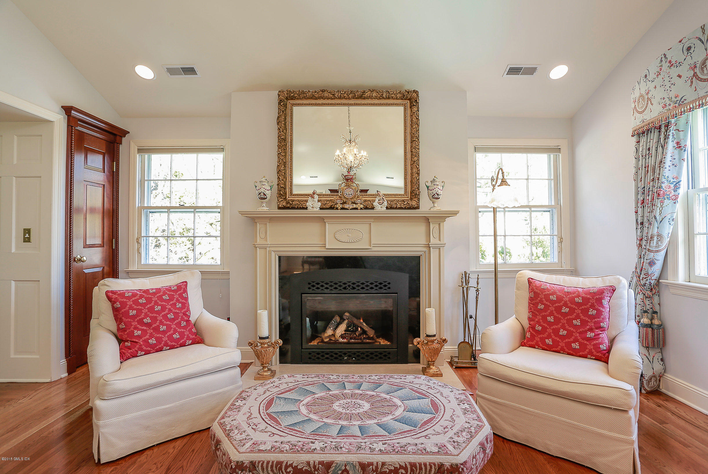 33 Doubling Road Greenwich, CT 06830 - Photo 16 of 45 a living room with furniture and a fireplace
