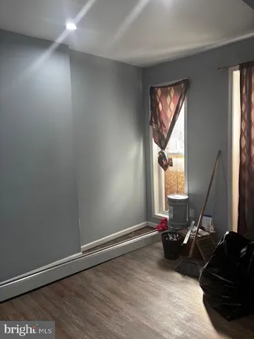 a view of a room with gym equipment and windows