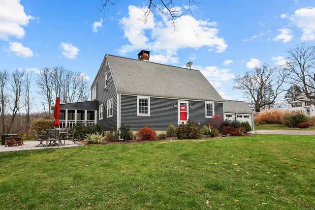a front view of house with yard and green space