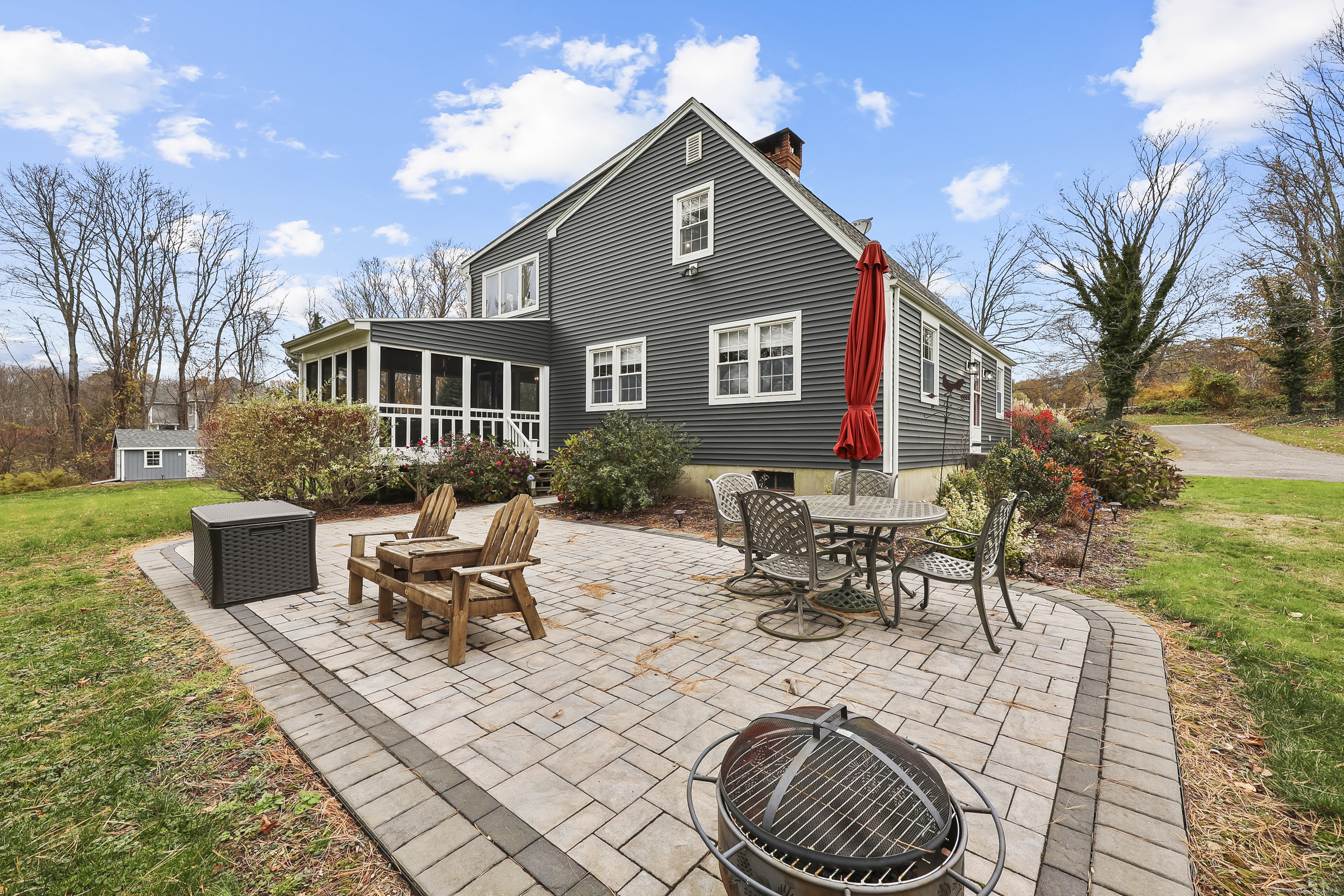 559 East Street Hebron, CT 06248 - Photo 12 of 31 a view of a house with backyard porch and sitting area