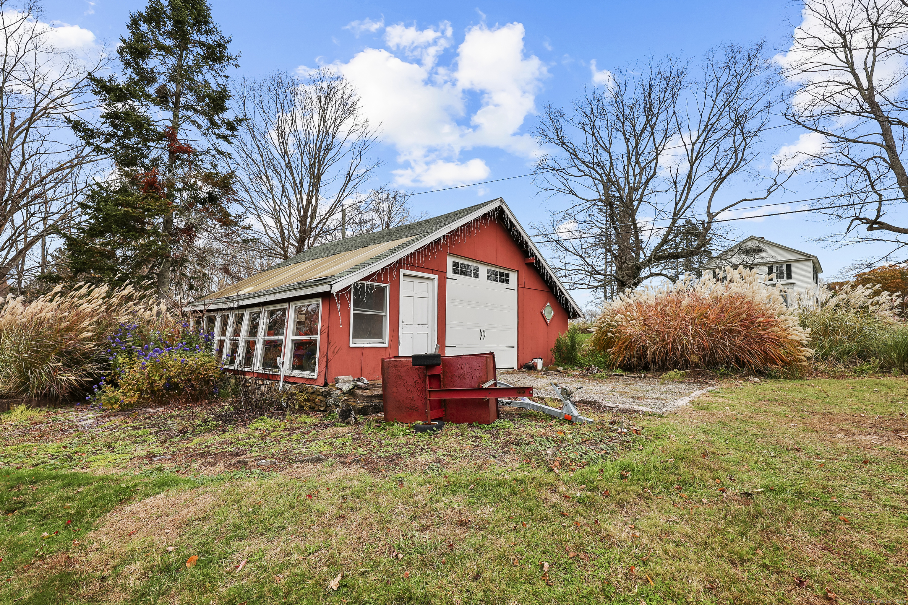 559 East Street Hebron, CT 06248 - Photo 16 of 31 a front view of house with yard and trees around