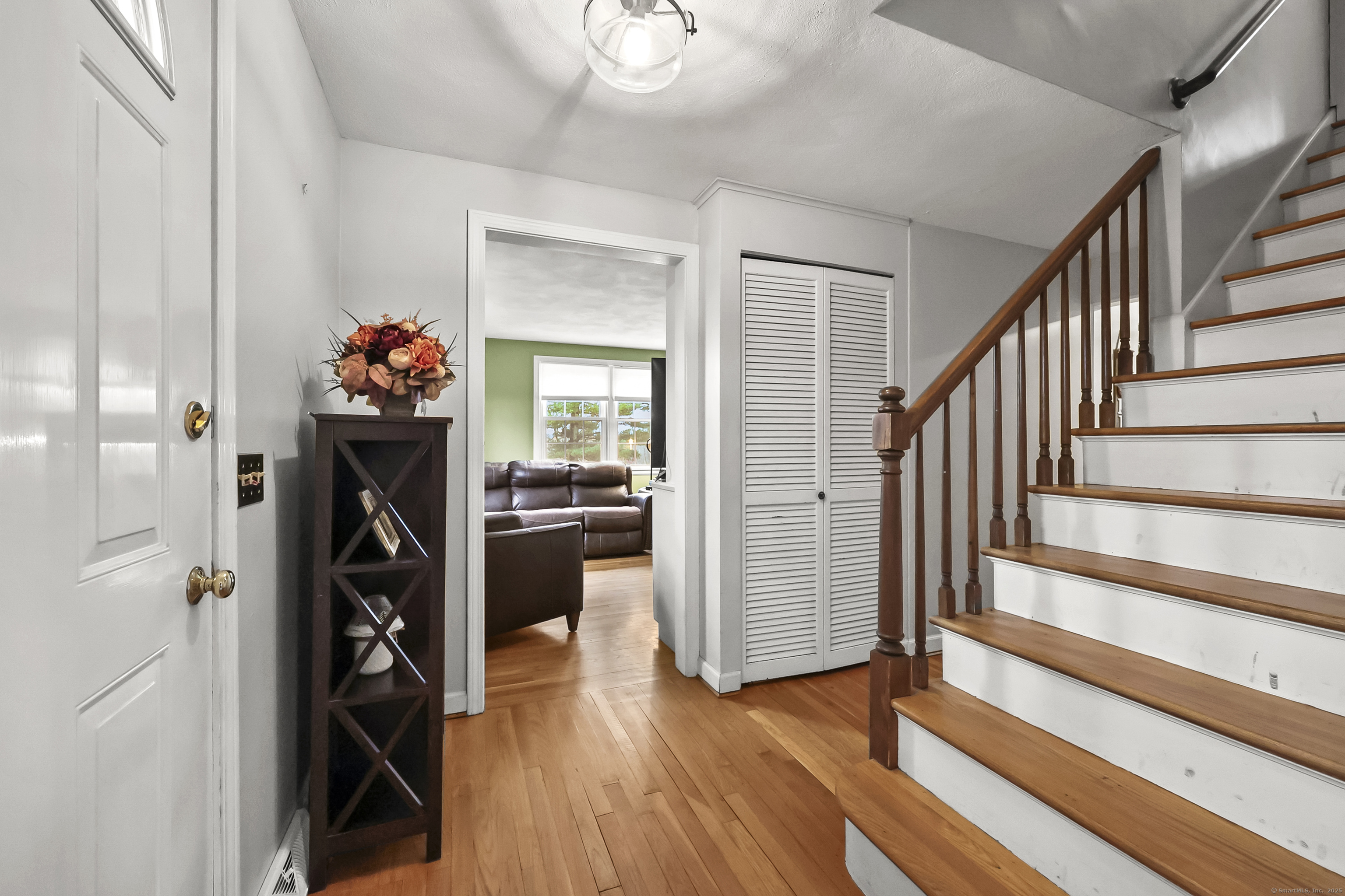 559 East Street Hebron, CT 06248 - Photo 18 of 31 a view of a hallway with wooden floor and stairs