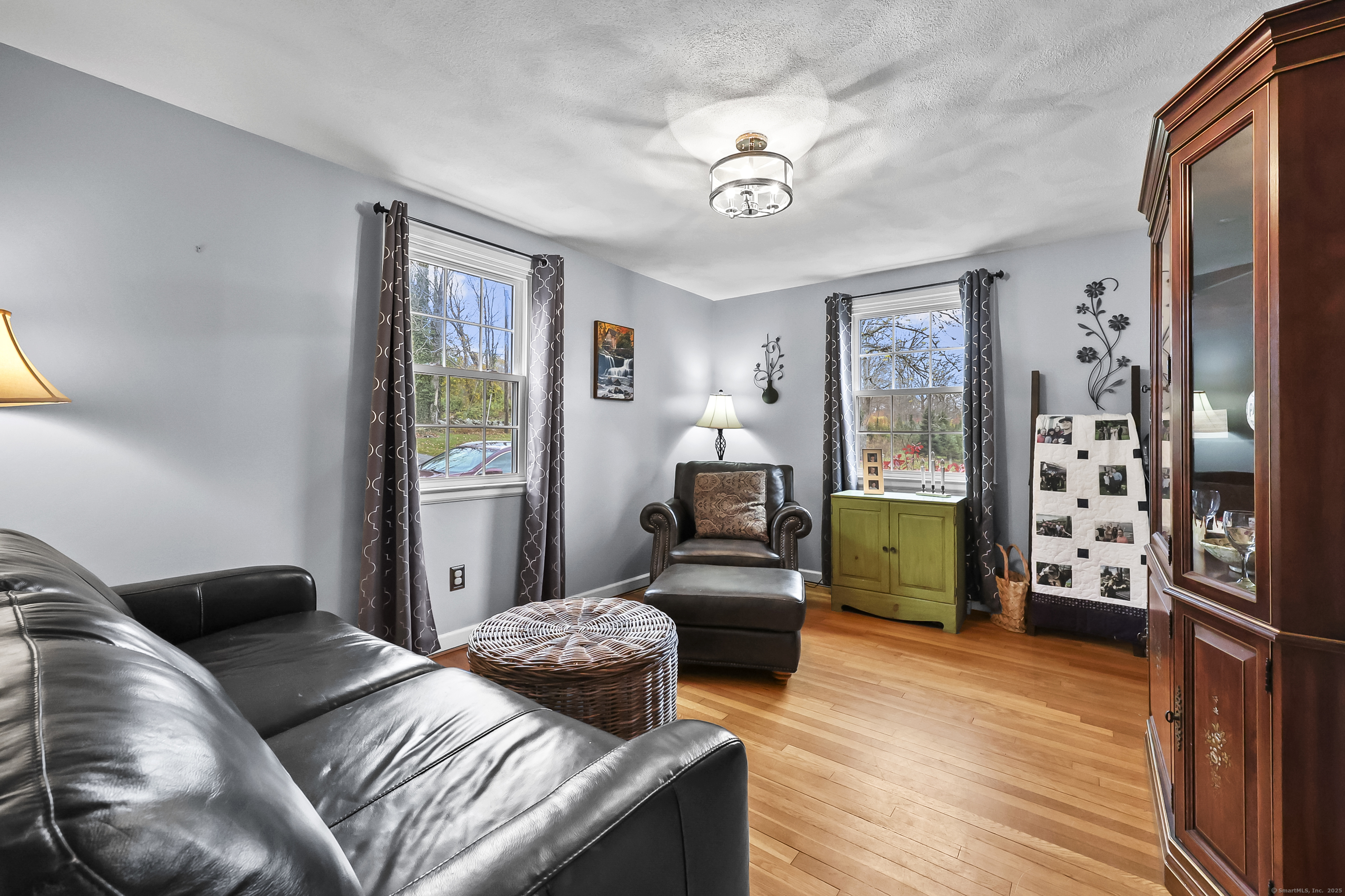 559 East Street Hebron, CT 06248 - Photo 21 of 31 a bedroom with furniture and a wooden floor