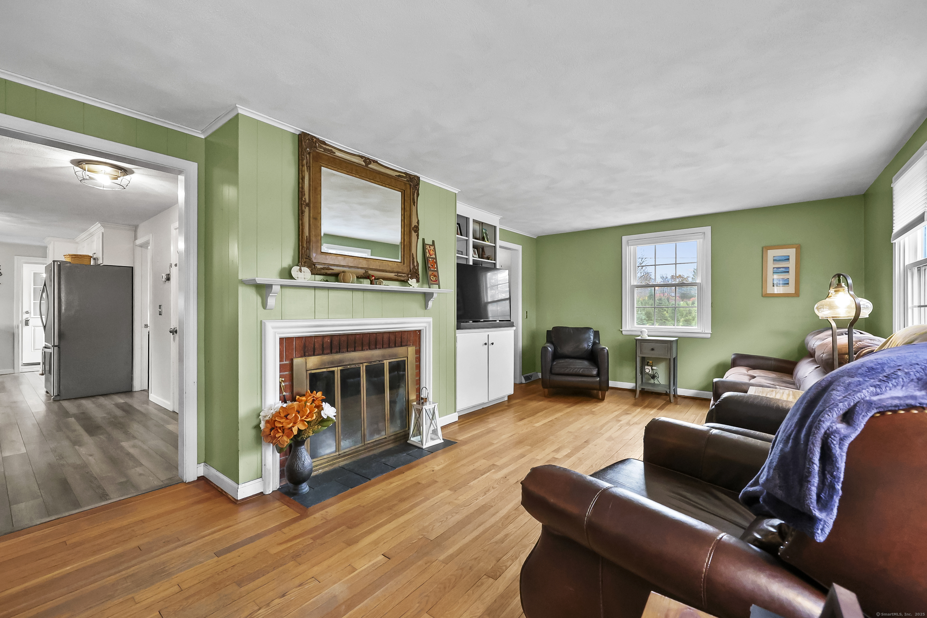 559 East Street Hebron, CT 06248 - Photo 8 of 31 a living room with furniture and a fireplace