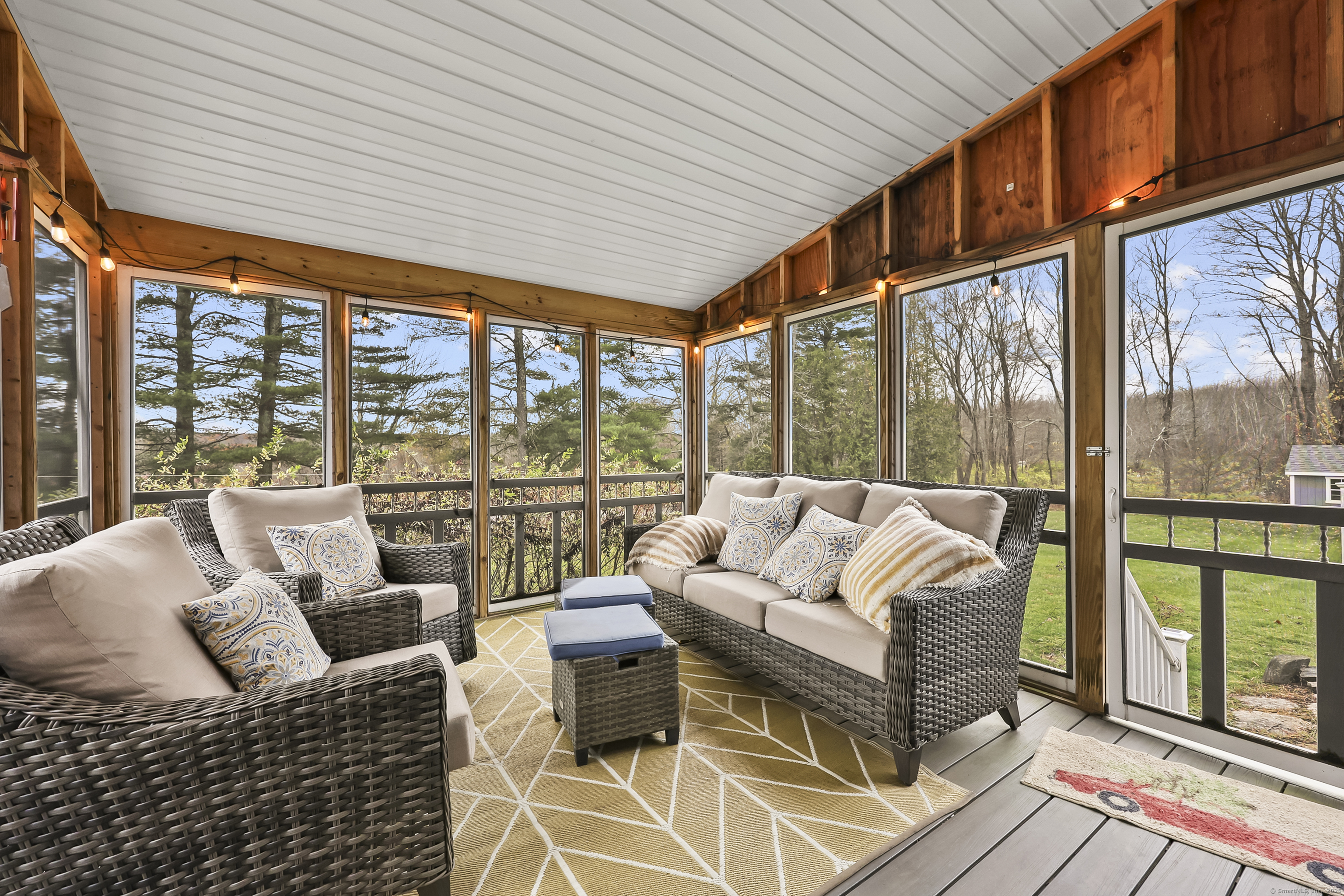 559 East Street Hebron, CT 06248 - Photo 10 of 31 a living room with furniture tv and large windows