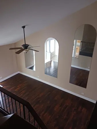 a view of wooden floor and a sink in a room