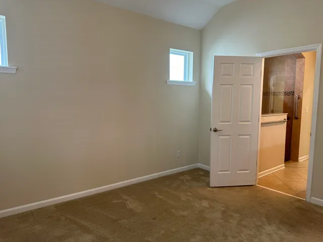 an empty room with closet area