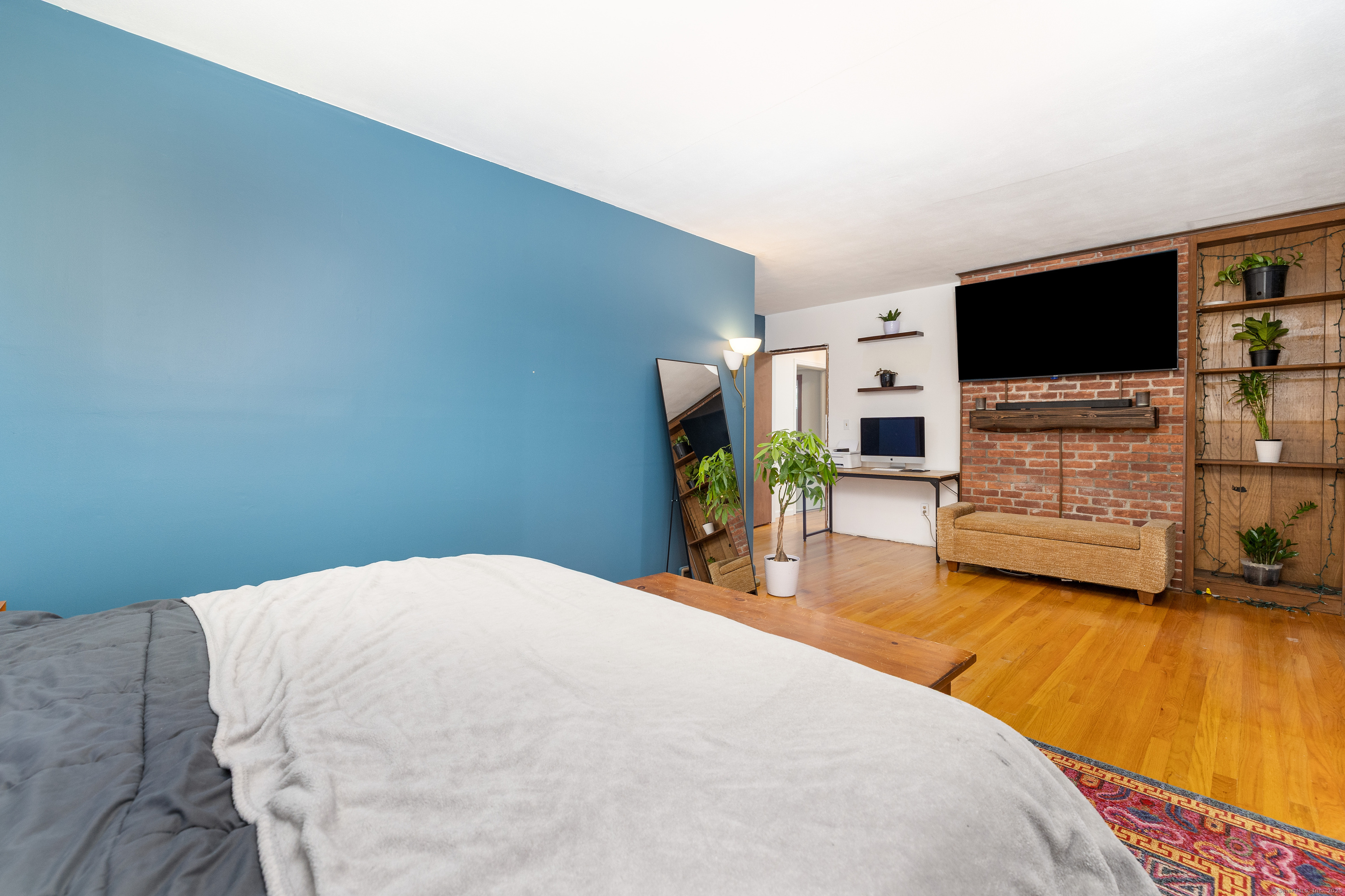 267 Hull Street Bristol, CT 06010 - Photo 17 of 22 a bedroom with a bed and a flat screen tv
