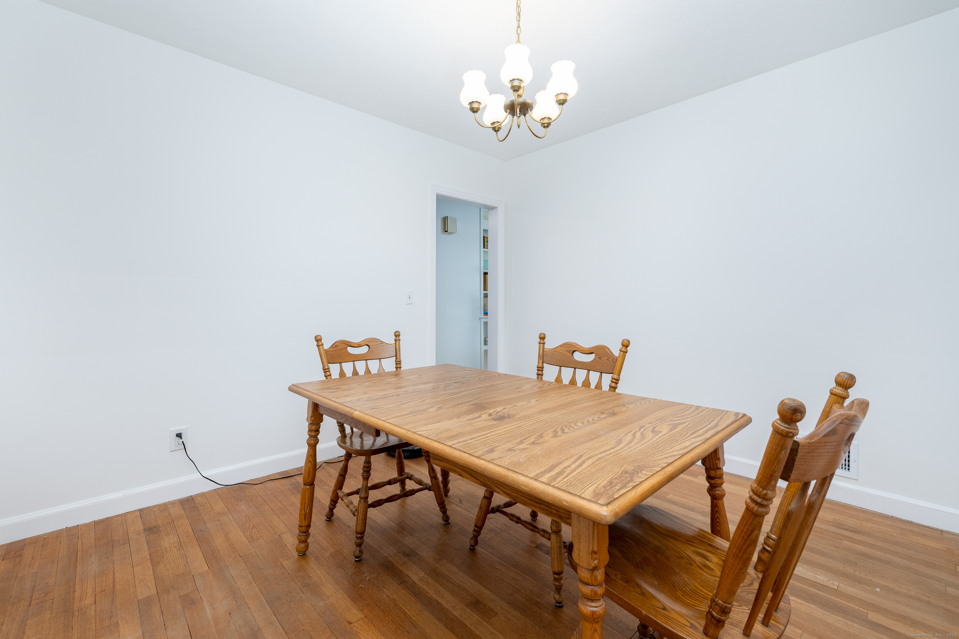 267 Hull Street Bristol, CT 06010 - Photo 18 of 22 a view of a dining room with furniture and wooden floor