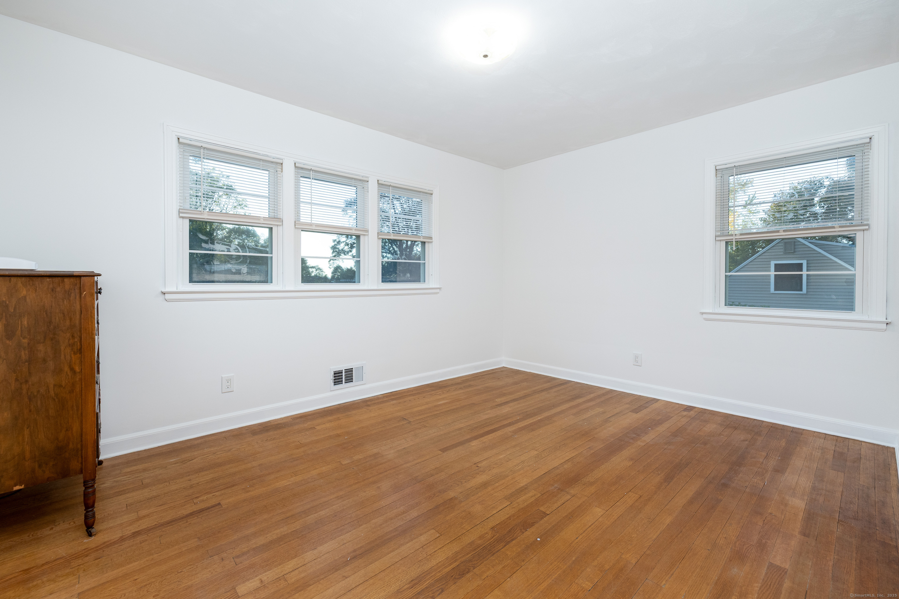267 Hull Street Bristol, CT 06010 - Photo 20 of 22 a view of empty room with wooden floor and fan