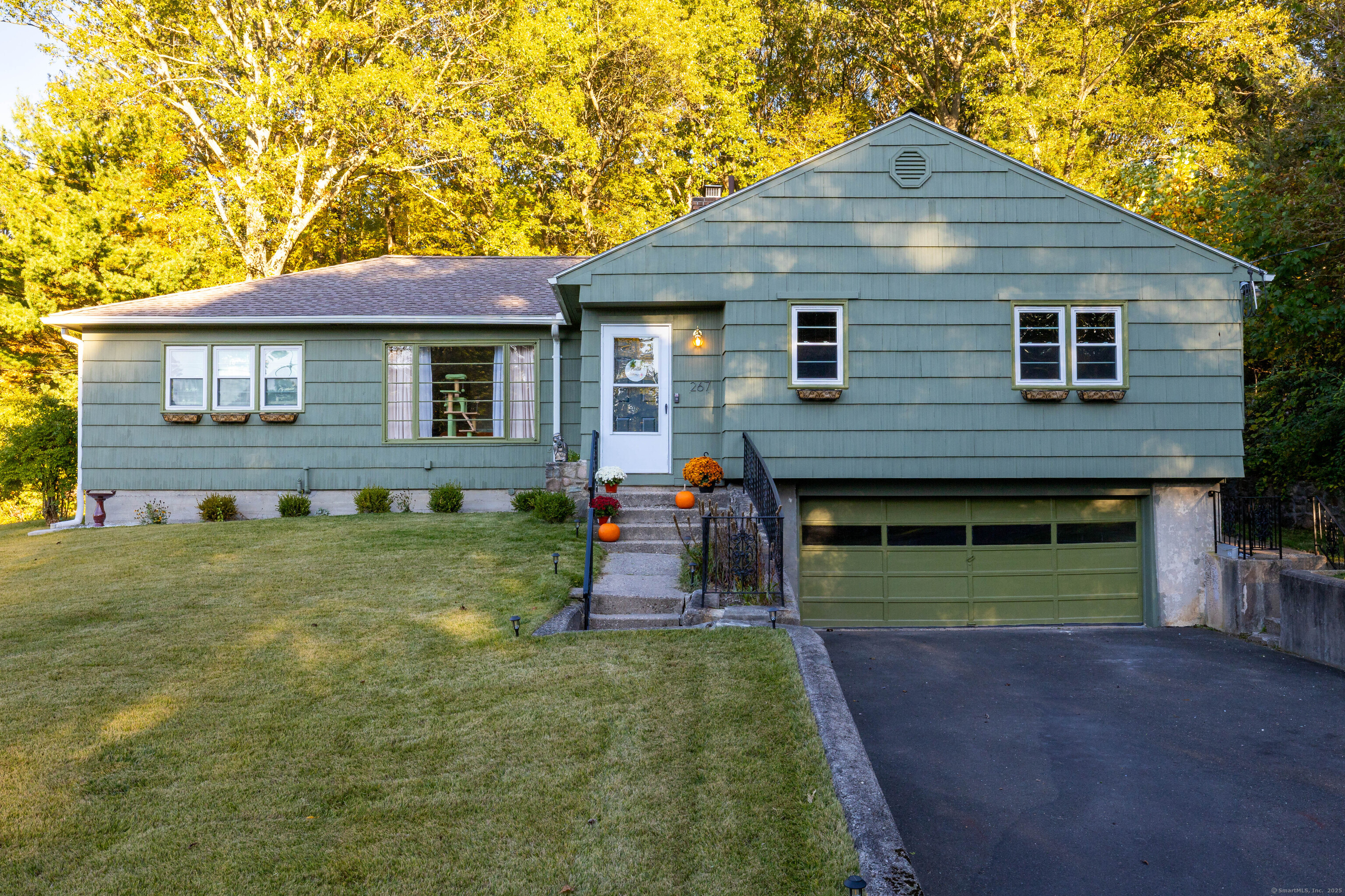 267 Hull Street Bristol, CT 06010 - Photo 2 of 22 a front view of a house with a yard