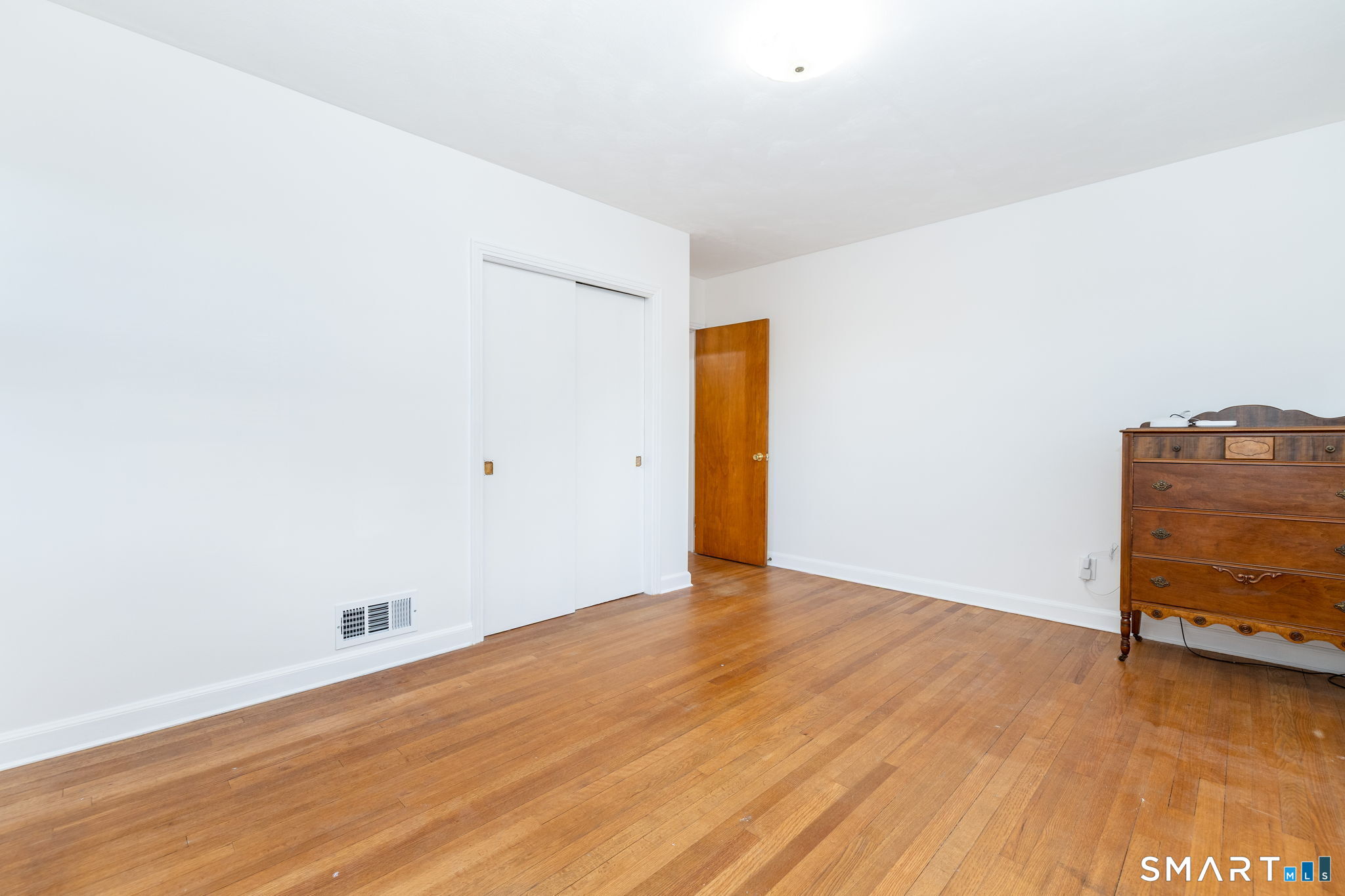 267 Hull Street Bristol, CT 06010 - Photo 22 of 22 a view of an empty room with wooden floor