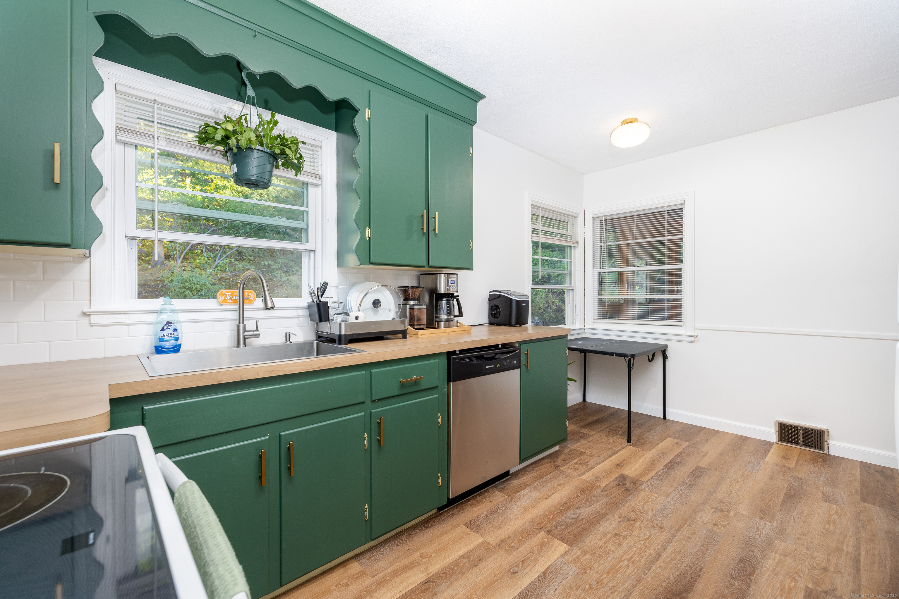 267 Hull Street Bristol, CT 06010 - Photo 5 of 22 a kitchen with a sink and a large window