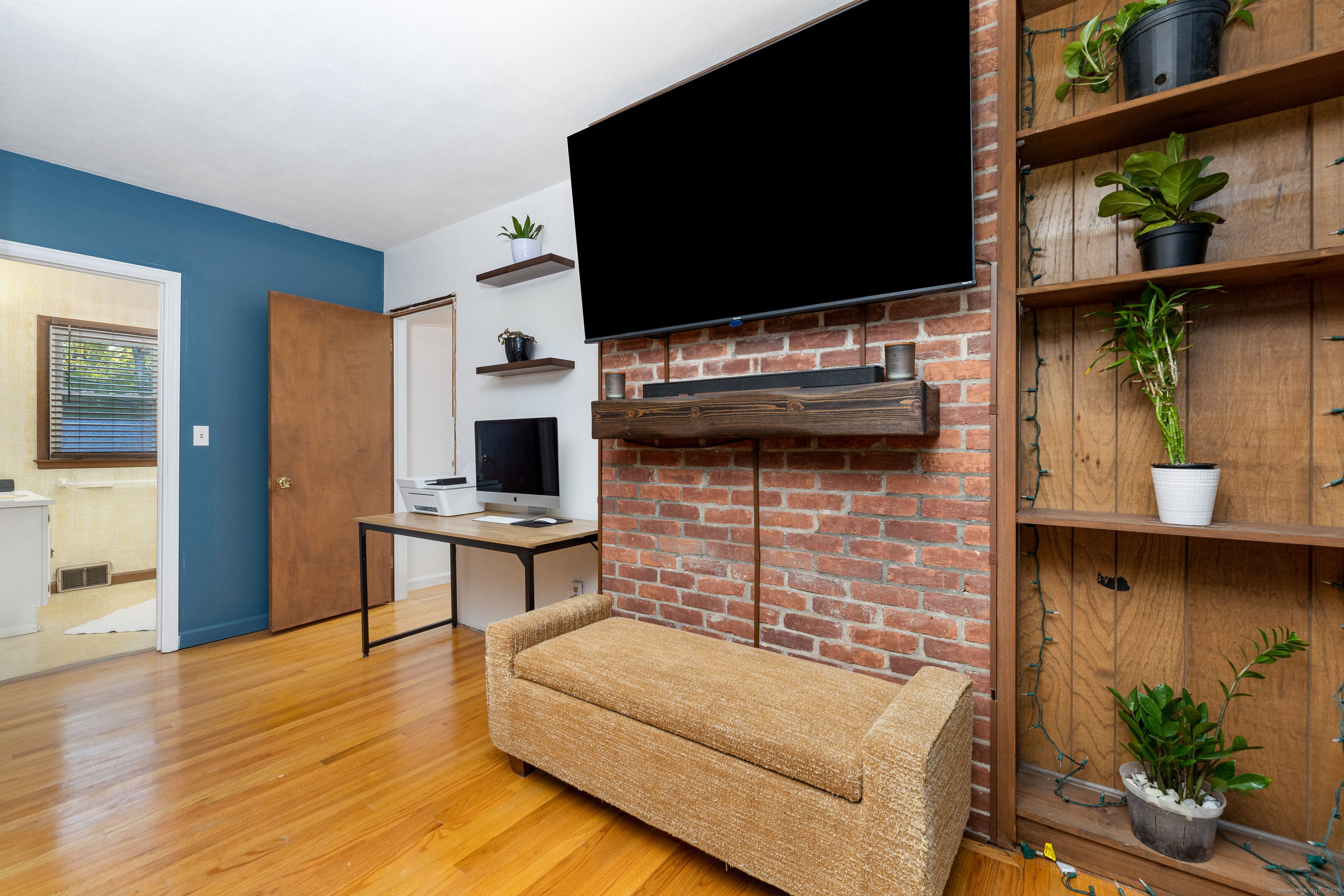 267 Hull Street Bristol, CT 06010 - Photo 8 of 22 a living room with furniture and a flat screen tv
