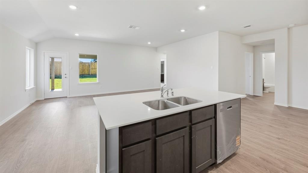312 Wild Rose Way Princeton, TX 75407 - Photo 21 of 39 a kitchen with a sink and a window