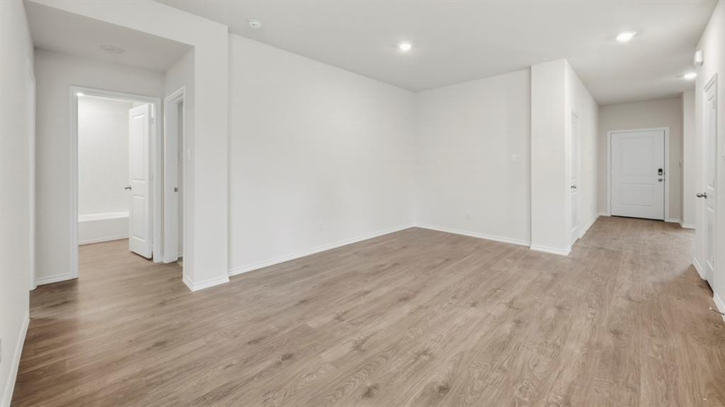 312 Wild Rose Way Princeton, TX 75407 - Photo 34 of 39 a view of empty room with wooden floor