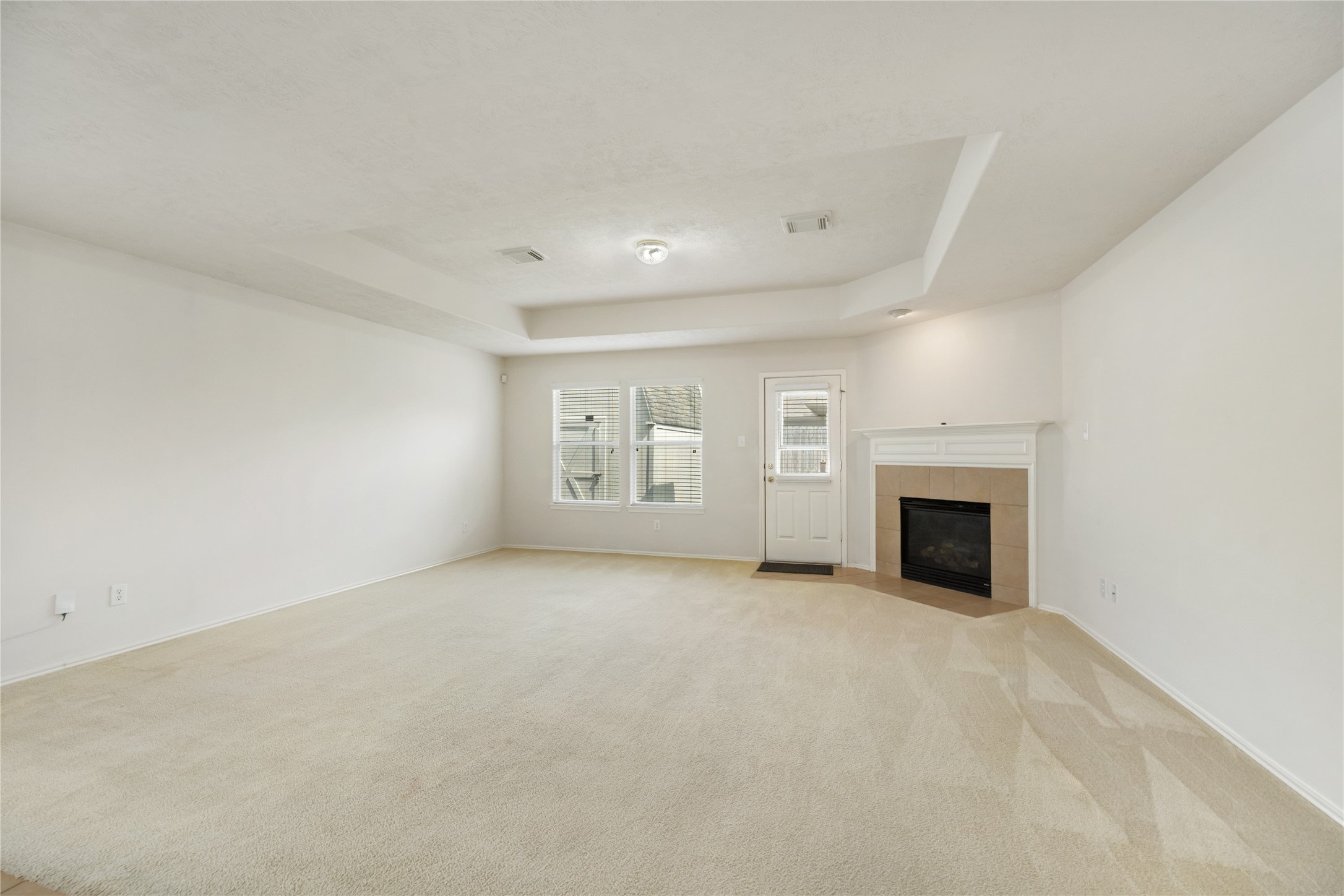9339 Canady Park Lane Houston, TX 77075 - Photo 12 of 44 Large living room/family room with gas fireplace and tray ceiling's.