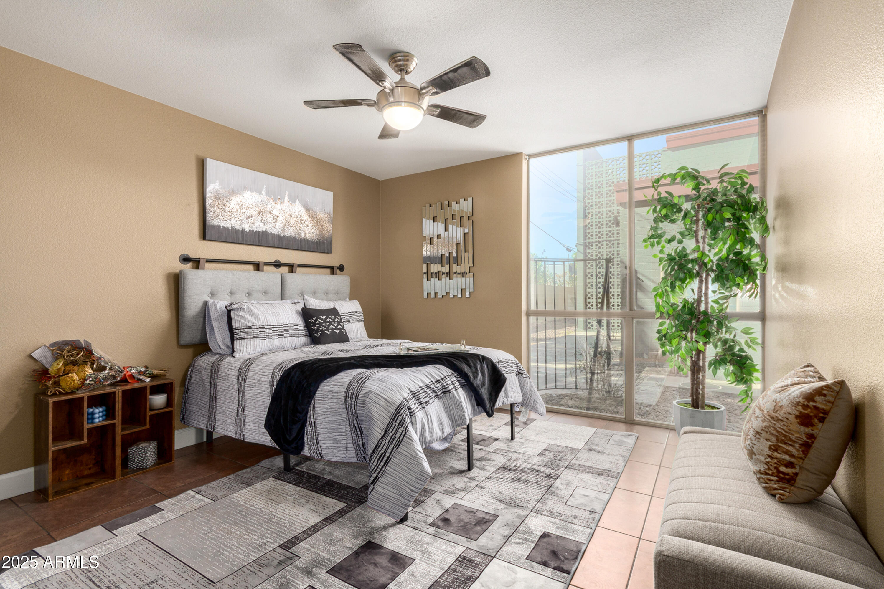 1241 East Medlock Drive, Unit 113 Phoenix, AZ 85014 - Photo 12 of 24 a bedroom with a bed and a large window