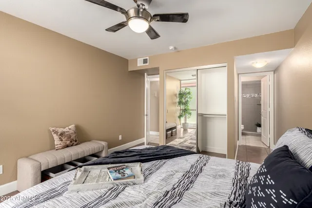 a bedroom with a bed and window