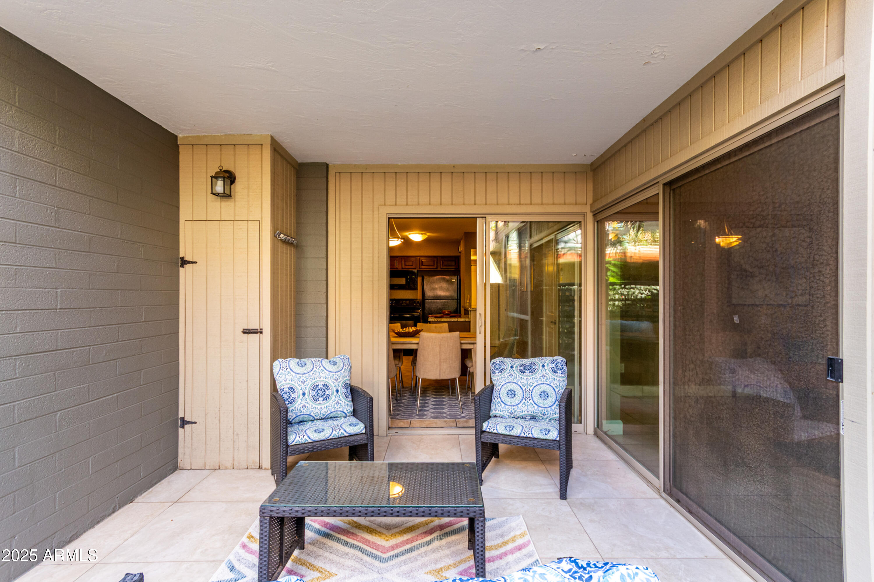1241 East Medlock Drive, Unit 113 Phoenix, AZ 85014 - Photo 20 of 24 a living room with furniture and a large window