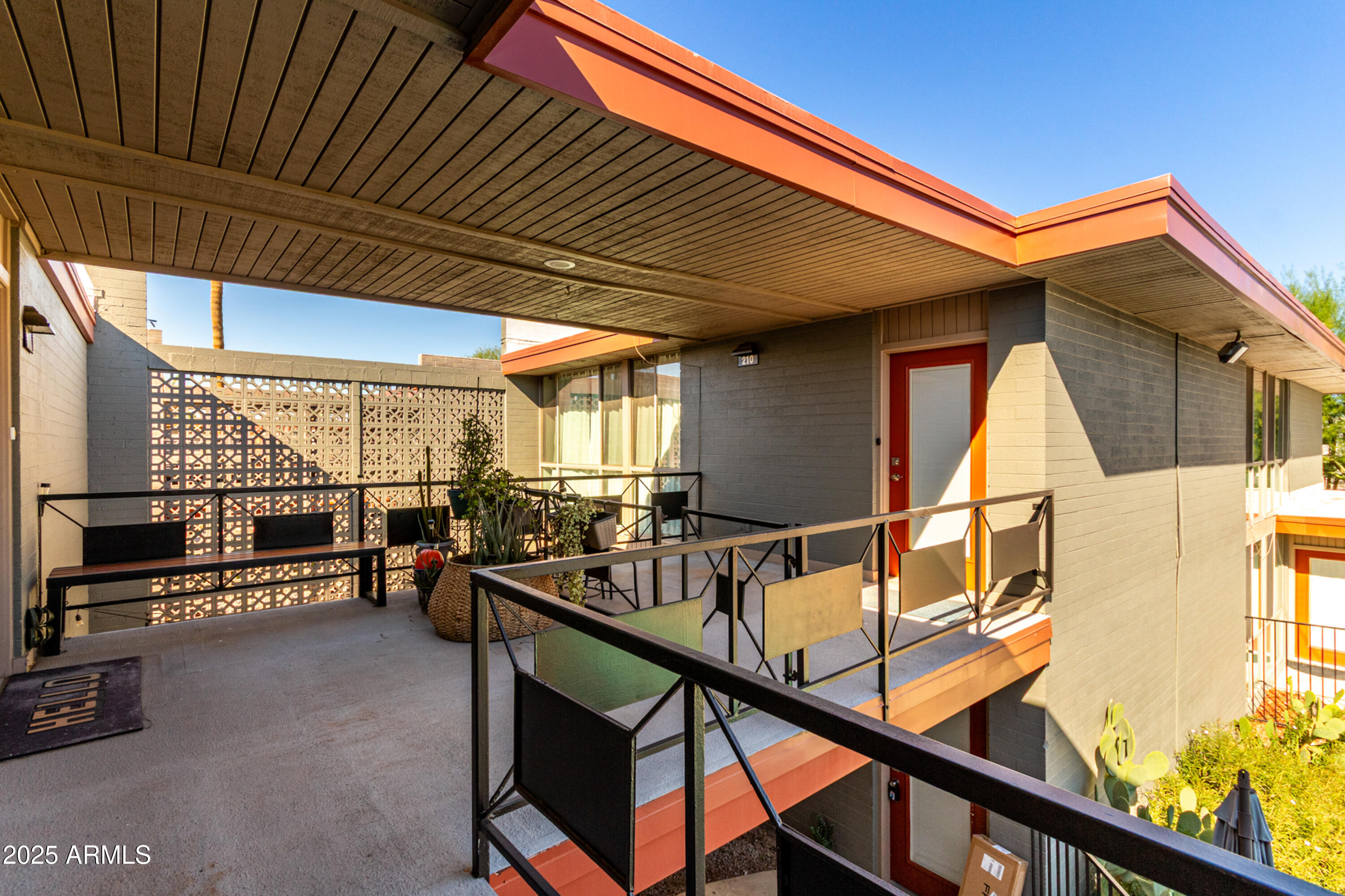 1241 East Medlock Drive, Unit 113 Phoenix, AZ 85014 - Photo 21 of 24 a view of an outdoor space with seating
