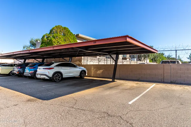 a view of a car park in front of house