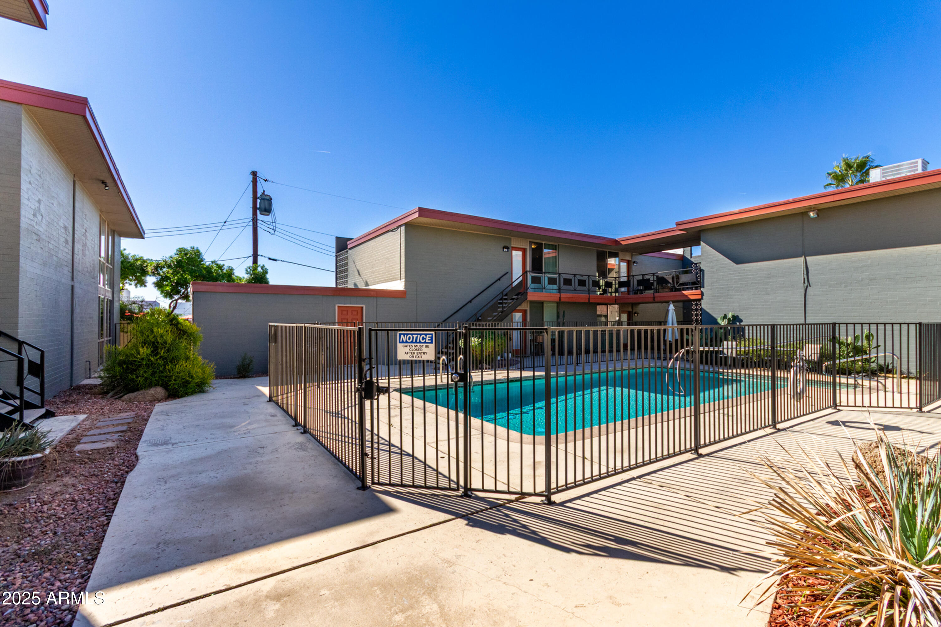 1241 East Medlock Drive, Unit 113 Phoenix, AZ 85014 - Photo 24 of 24 a view of a house with a balcony