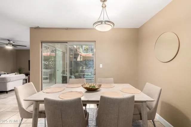 a dining room with a table and chairs