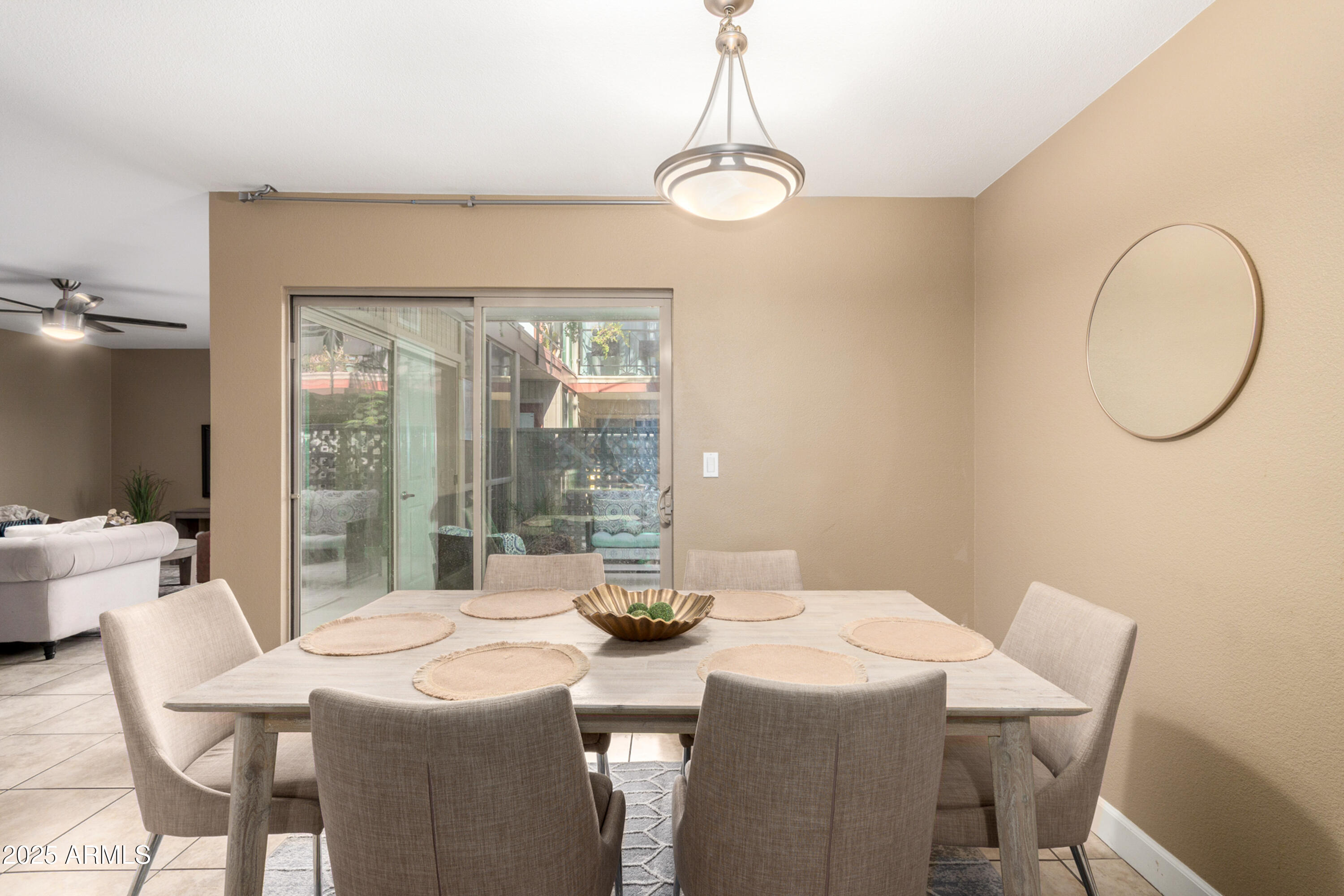 1241 East Medlock Drive, Unit 113 Phoenix, AZ 85014 - Photo 6 of 24 a dining room with a table and chairs