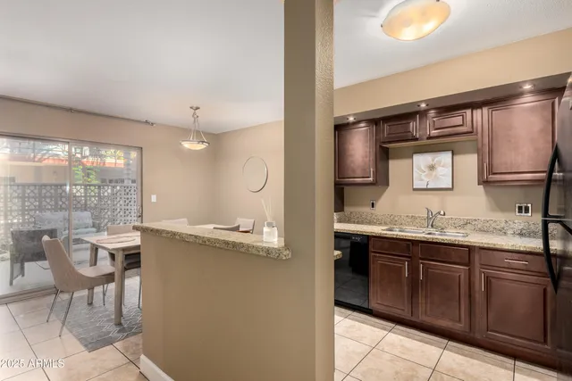 a kitchen with a sink and stove