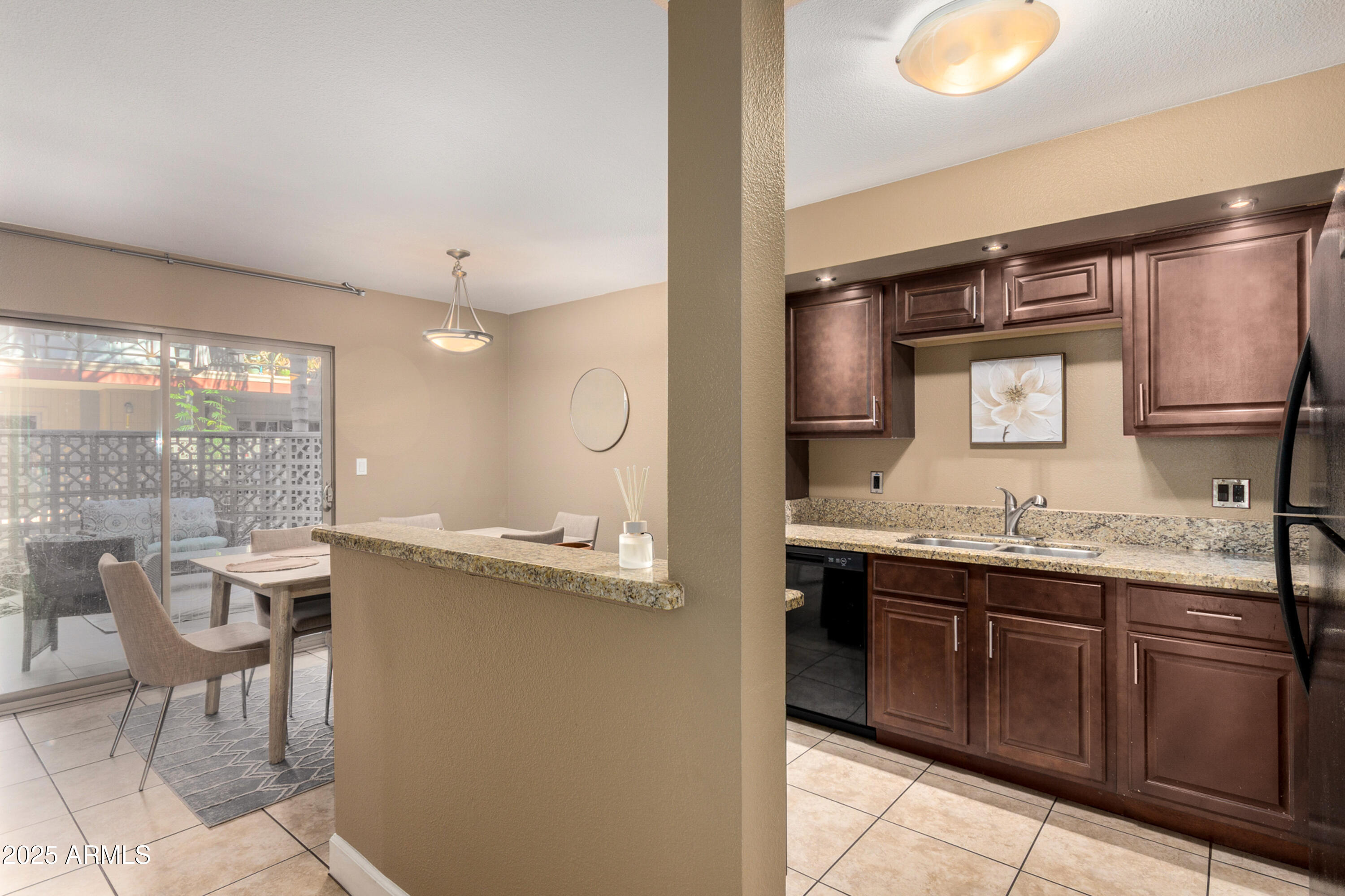 1241 East Medlock Drive, Unit 113 Phoenix, AZ 85014 - Photo 8 of 24 a kitchen with a sink and stove