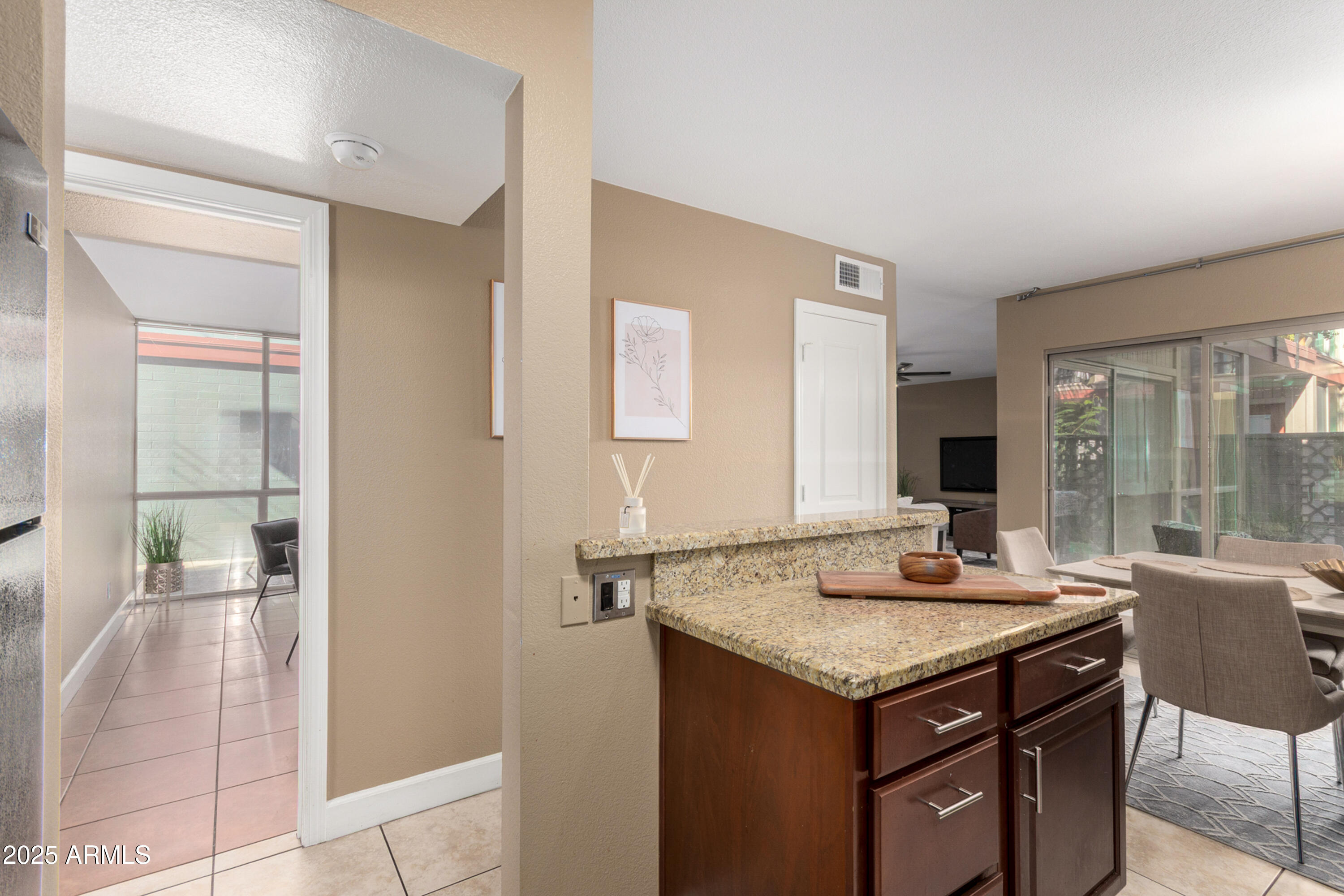 1241 East Medlock Drive, Unit 113 Phoenix, AZ 85014 - Photo 9 of 24 a kitchen with a stove a sink and a refrigerator