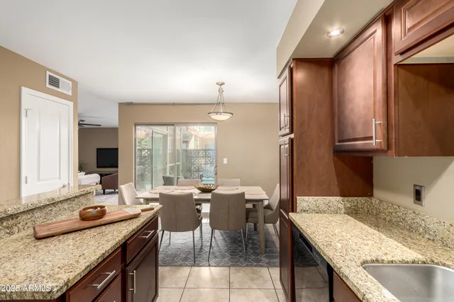 a kitchen with a stove a sink and a refrigerator
