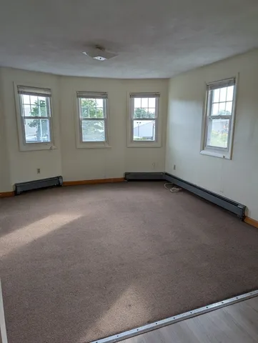 a view of an empty room with windows
