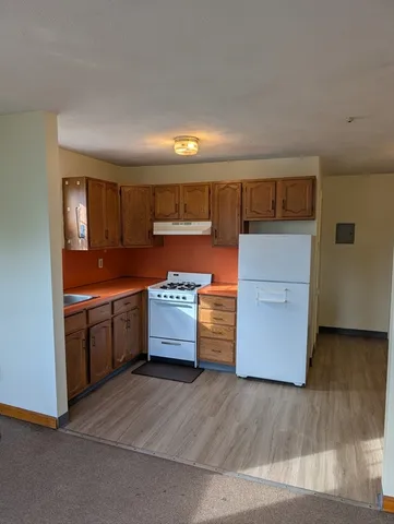 a kitchen with stainless steel appliances a stove and a refrigerator
