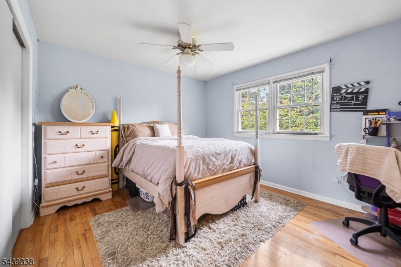1 Oak Grove Road Flemington, NJ 08822 - Photo 20 of 29 a bedroom with a bed and wooden floor