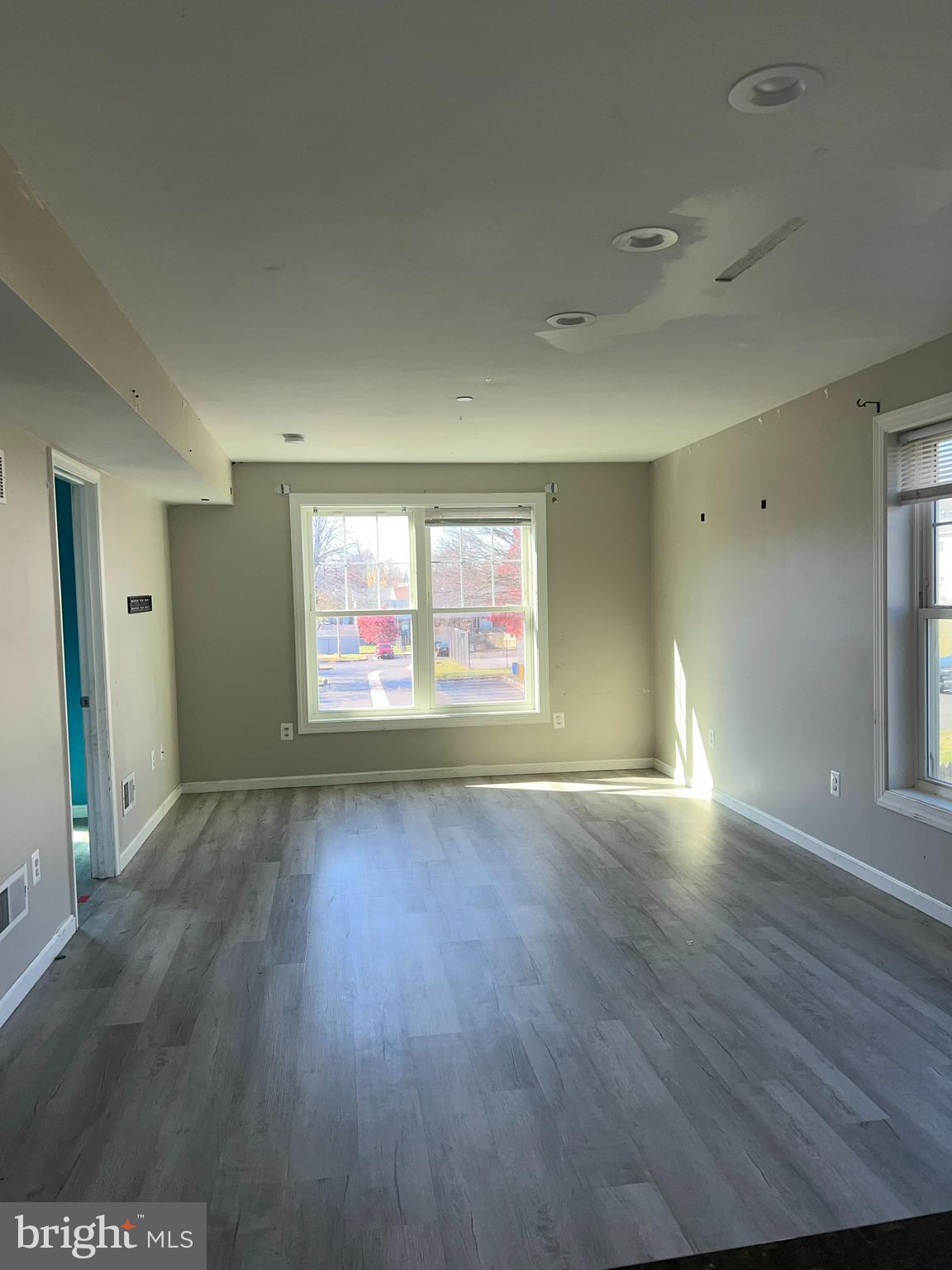 191 East George Street Westminster, MD 21157 - Photo 5 of 10 an empty room with wooden floor and windows
