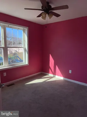 a view of empty room with windows