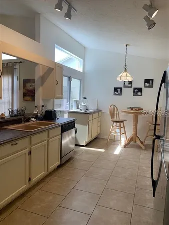a kitchen with a cabinets and chairs
