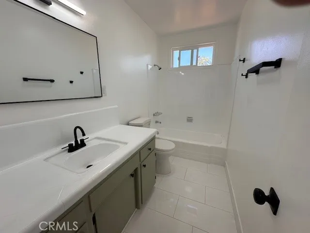 14621 Clark Street Baldwin Park, CA 91706 - Photo 12 of 28 a bathroom with a sink and mirror